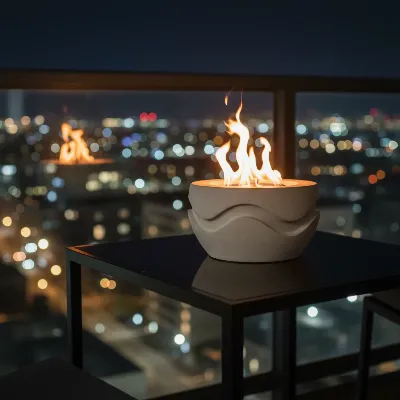 TerraFlame by Solo Stove Wave Fire Bowl on a minimalist balcony at night.